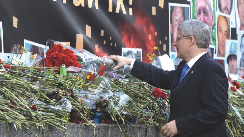 Prime Minister Stephen Harper lays flowers at a memorial in Kyiv as a symbol of Canada’s respect for those who died while standing up for democratic change in Ukraine