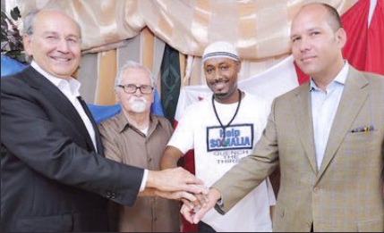 Ukrainian Canadian Congress ‘African Famine Relief’ $100,000 donation presentation. (L. to R.): Jim Temerty – major donor, Stefan Horlatsch - Holomodor survivor, Hassan Adan - ARAN Somali Canadian Relief coordinator, and Paul Grod – UCC President